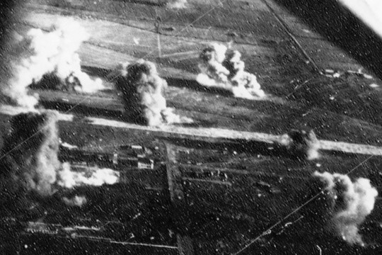 Carrier aircraft of Task Force 38 attacking the Japanese Army airfield at Takao (now Kaohsiung), Taiwan, 12 Oct 1944, photo 2 of 4; US intelligence referred to this field as 'Reigaryo Airfield'