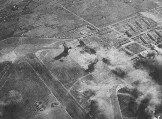 Shinchiku Airfield under US Navy carrier aircraft attack, Taiwan, 12 Oct 1944, photo 1 of 2