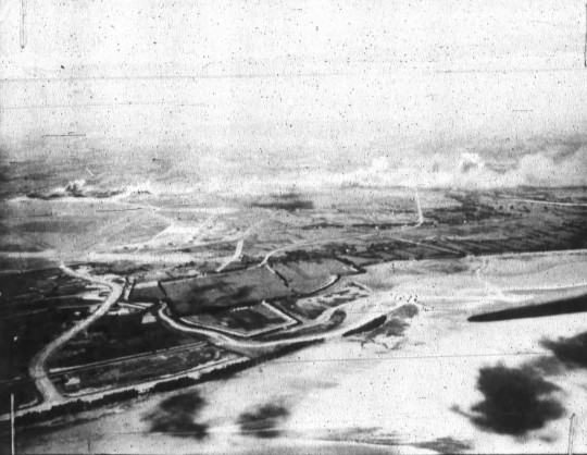 Shinchiku Airfield under US Navy carrier aircraft attack, Taiwan, 13 Oct 1944, photo 2 of 2
