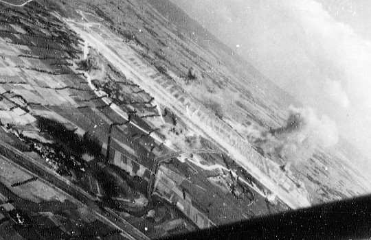 Shoka Airfield in Shoka (now Changhua), Taiwan under US Navy carrier aircraft attack, 12 Oct 1944, photo 2 of 2