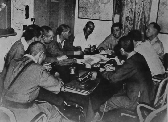 USMC Colonel A. D. Cooley conferring with Japanese officers over the liberation of US prisoners of war, Taiwan, 5 Sep 1945