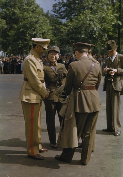 An Iranian, a Chinese, and two British officers in conversation during the United Nations Day Parade, London, England, United Kingdom, 14 Jun 1943