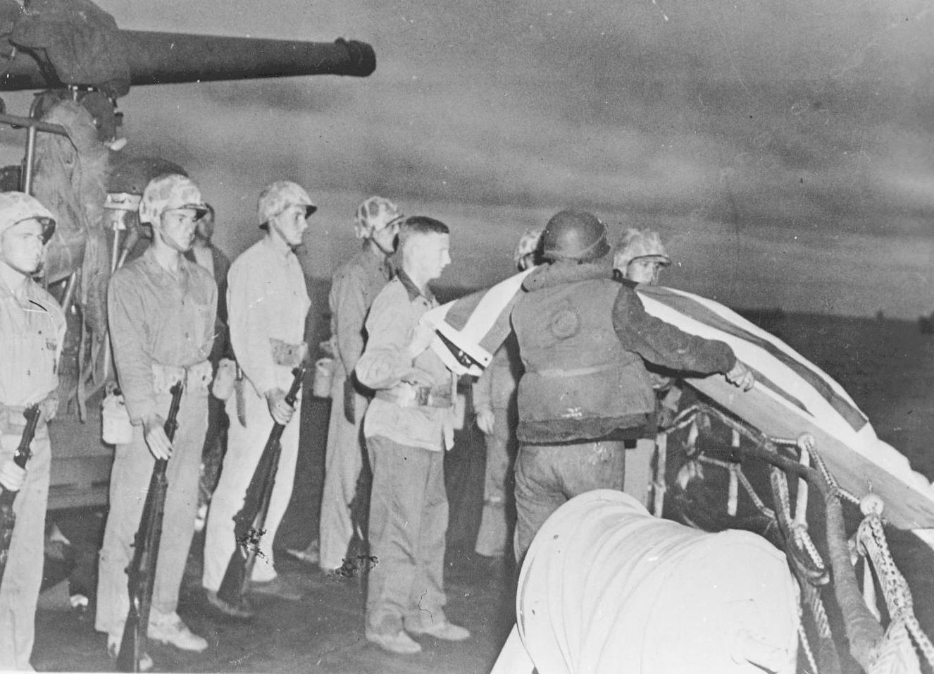 Burial at sea aboard a US Coast Guard ship with Marine Corps honor guard, in the Pacific Ocean off Iwo Jima, Japan, Feb 1945
