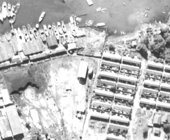 Aerial reconnaissance photo of facilities at Takao naval base, Taiwan, 13 Oct 1944, photo 2 of 2; note barrage balloon