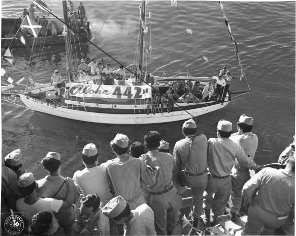 Yacht 'Lady Joe' welcoming returning Japanese-American veterans of US 442nd Regimental Combat Team aboard Victory Ship USS Waterbury Victory, Honolulu, US Territory of Hawaii, 9 Aug 1946, photo 1 of 2
