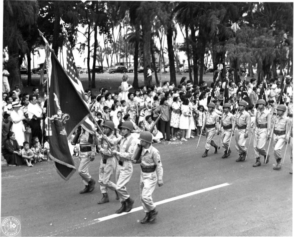 Japanese-American troops of US 442nd Regimental Combat Team marching in the Veterans Day Parade at Kapiolani Park, Honolulu, US Territory of Hawaii, 15 Aug 1946, photo 1 of 2
