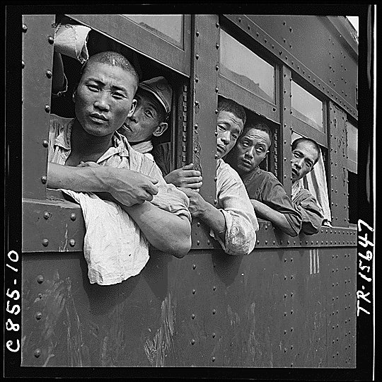 Japanese troops returning home aboard a train after the end of the Pacific War, Japan, Sep 1945