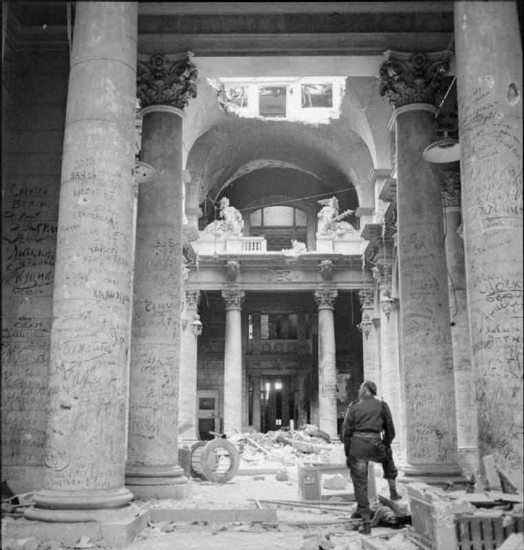 Graffiti left by Russian soldiers covered the pillars inside the ruins of the German Reichstag building in Berlin, Germany, 3 Jul 1945