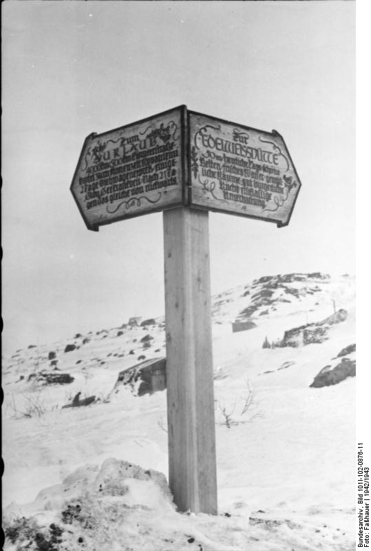 German festive road signs pointing toward 'Holiday' and 'Edelweiss Cabin', Finland or Norway, 1942-1943