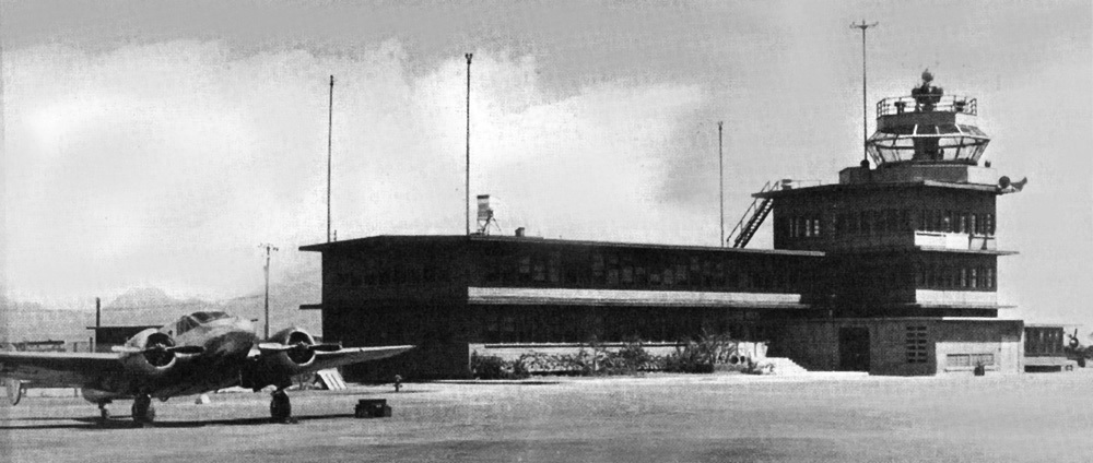 SNB Expeditor sitting in frot of the control tower at Marine Corps Air Station Ewa, US Territory of Hawaii, 1940s
