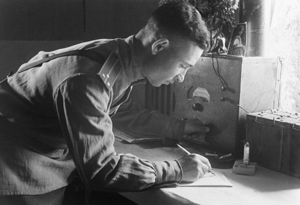 First Lieutenant Zinoviy Shkapenyuk of 48th Army of Soviet 1st Byelorussian Front writing a newspaper article for Slovo Boitsa, 1944