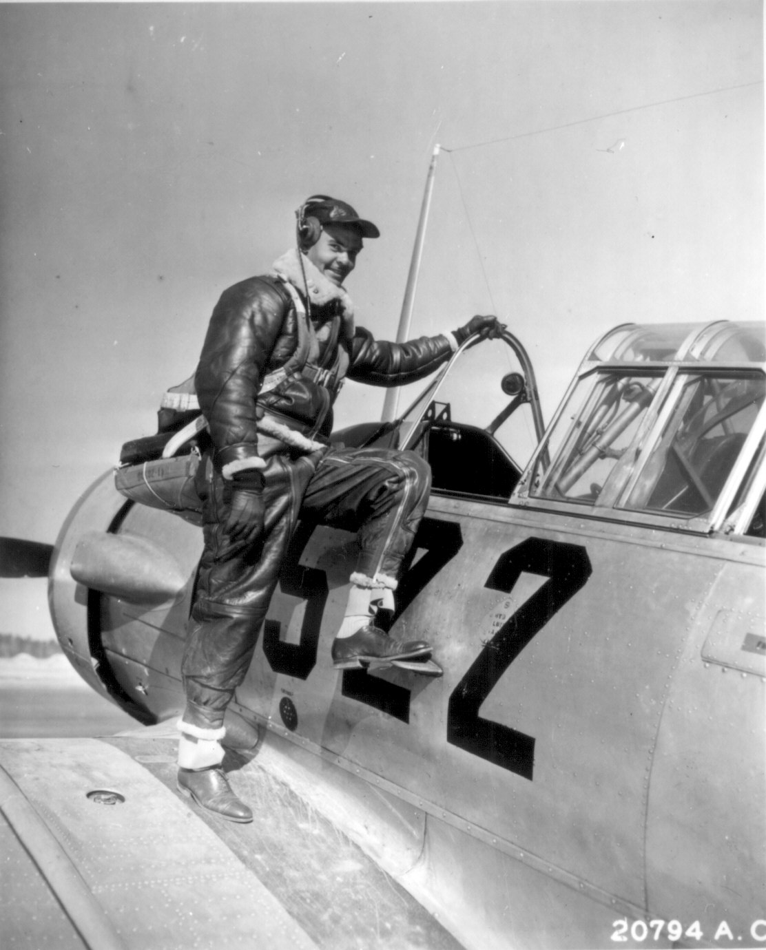 US Army Air Force pilot Captain Benjamin Oliver Davis, Jr. climbing into a Vultee AT-6 Texan aircraft, Tuskegee, Alabama, United States, Jan 1942