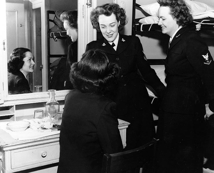 WAVES Storekeeper 2nd Class Francella Leigh, Yeoman 2nd Class Patricia McRae, and Pharmacist's Mate 3rd Class Suzanne Hosmer on board a transport en route to US Territory of Hawaii, 8 Jan 1945