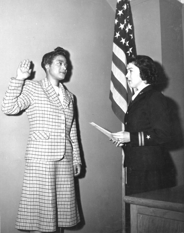 Harriet Ida Pickens being sworn in as WAVES apprentice seamen by Lieutenant Rosamond D. Selle, New York City, New York, United States, Nov 1944