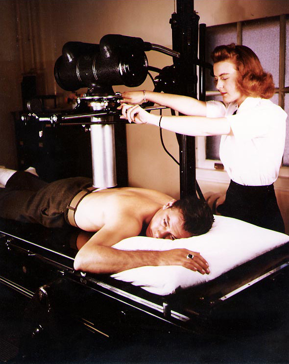 WAVES Pharmacist's Mate 3rd Class Winifred Perosky X-Rayed USMC Private First Class Harold Reyher, who was wounded at Iwo Jima, Naval Hospital, San Diego, California, United States, spring 1945