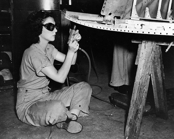 WAVES Airman 1st Class (Aviation Metalsmith) Barbara Stroud drilling and riveting aircraft structure in the Assembly and Repair Department at Naval Air Station, Jacksonville, Florida, United States, 2