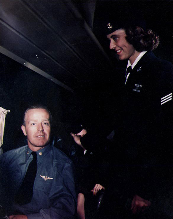WAVES Seaman 1st Class Patricia A. Branch attending to an officer aboard a Naval Air Transport Service flight, circa mid-1945