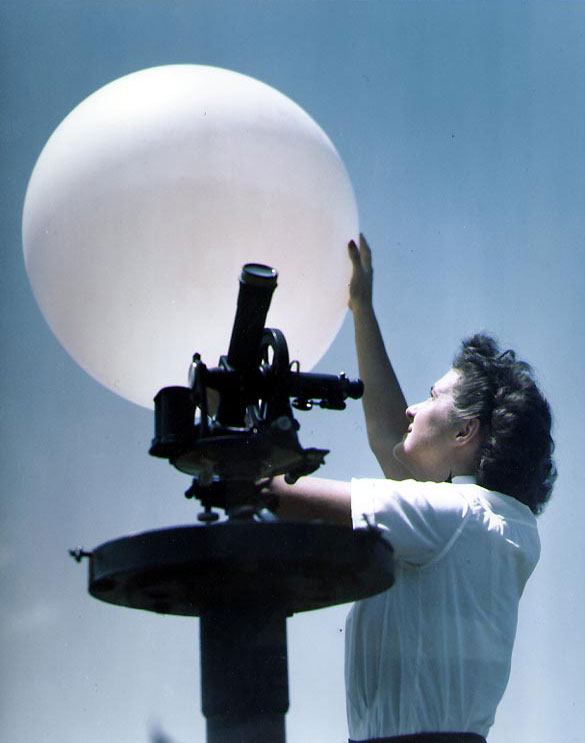 WAVES Aerographer's Mate 2nd Class Julia Murray launching a weather balloon from a theodolite platform at Naval Air Station, Santa Ana, California, United States, circa mid-1945