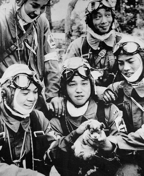 Corporal Yukio Araki (with puppy) with fellow pilots of Japanese Army 72nd Shinbu Squadron, Bansei Airfield, Kagoshima Prefecture, Japan, 26 May 1945