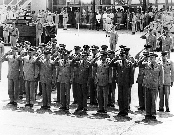 Senior US military officers saluting as Forrest Sherman's body arrived at Washington National Airport, Virginia, United States, 25 Jul 1951