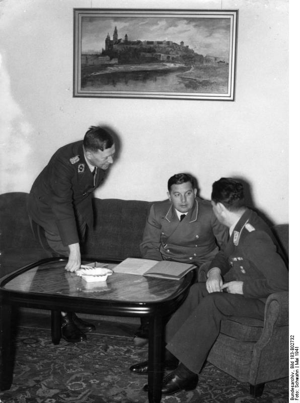 Hans Frank's staff members Dr. Eisfeld, State Secretary Josef Bühler, and Under State Secretary Kundt in Kraków, Poland, 12 May 1941
