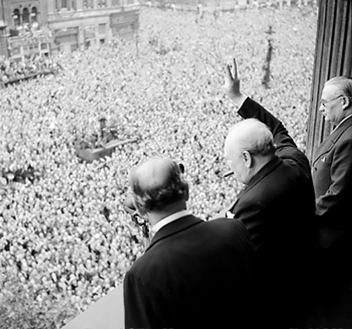 Churchill waving to crowds at Whitehall, London, England, United Kingdom on the day he announced the war with Germany had been won, 8 May 1945
