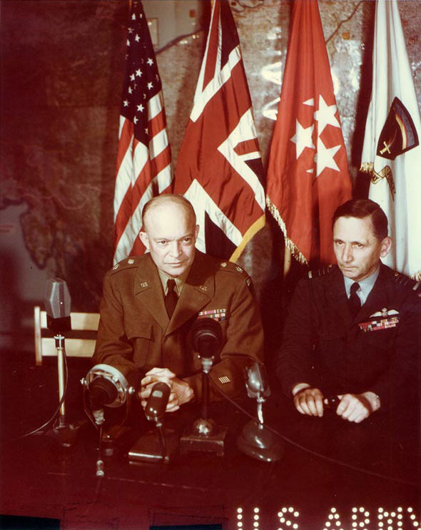 Eisenhower and Tedder addressed the world over radio and motion picture shortly after the signing of the German surrender documents, Rheims, France, 7 May 1945