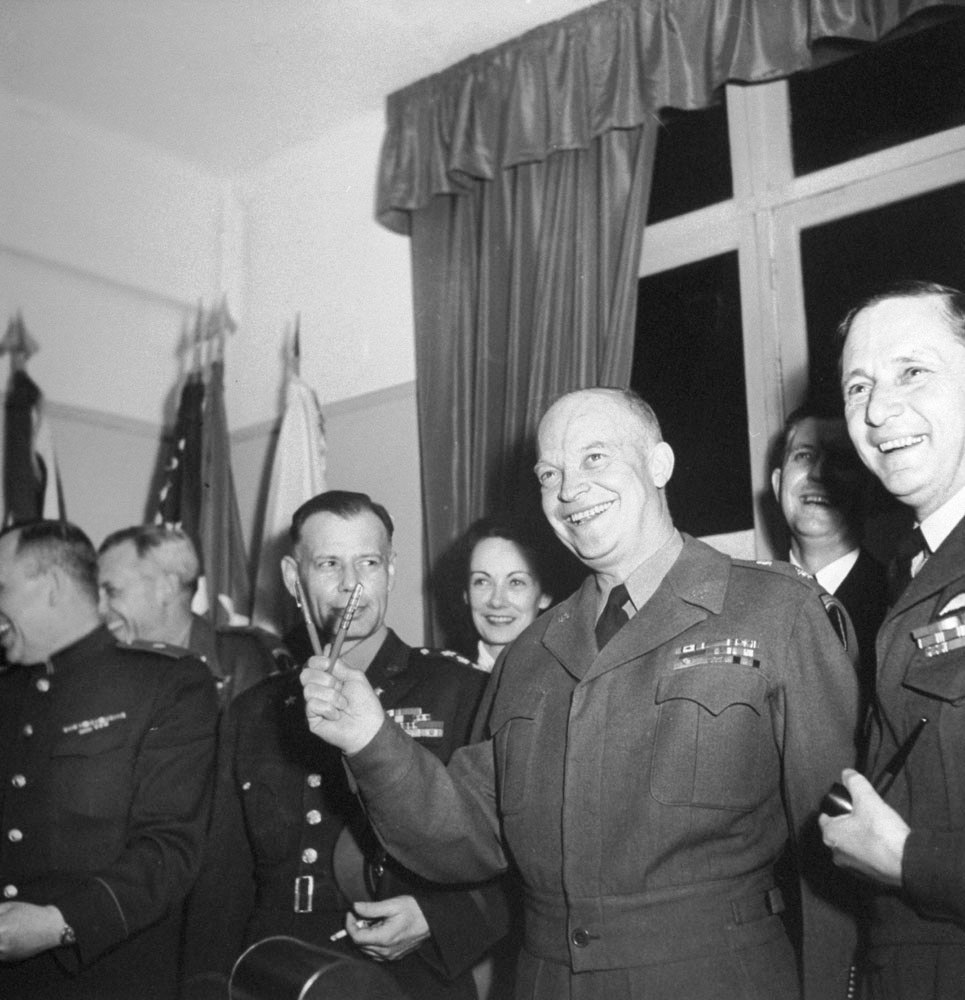 Generals Susloparov, Morgan, Smith, Eisenhower, Air Chief Marshal Tedder after signing of German surrender documents, Rheims, France, 7 May 1945, photo 3 of 3; note Eisenhower holding pens used