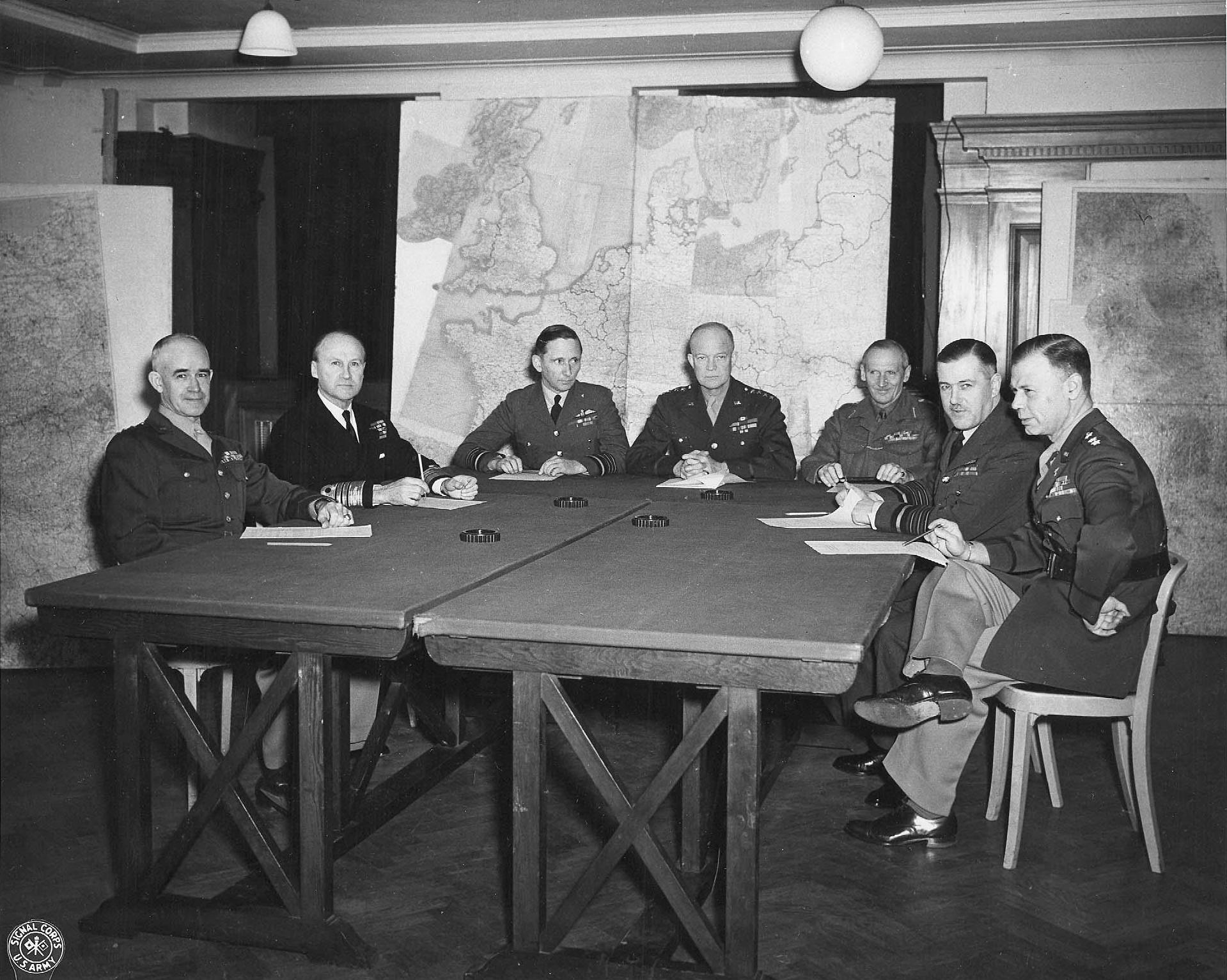 Bradley, Ramsay, Tedder, Eisenhower, Montgomery, Leigh-Mallory, and Smith at a SHAEF conference in London, England, United Kingdom, 1 Feb 1944, photo 1 of 7