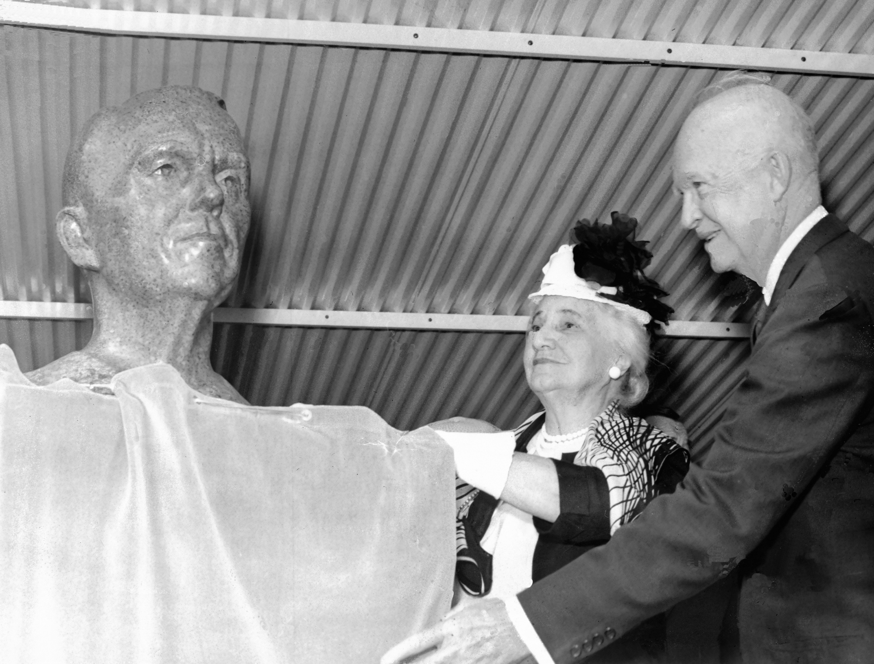 US President Dwight Eisenhower and George Marshall's widow Kathrine Boyce Tupper unveiling a bust of Marshall, Marshall Space Flight Center, Huntsville, Alabama, United States, 8 Sep 1960