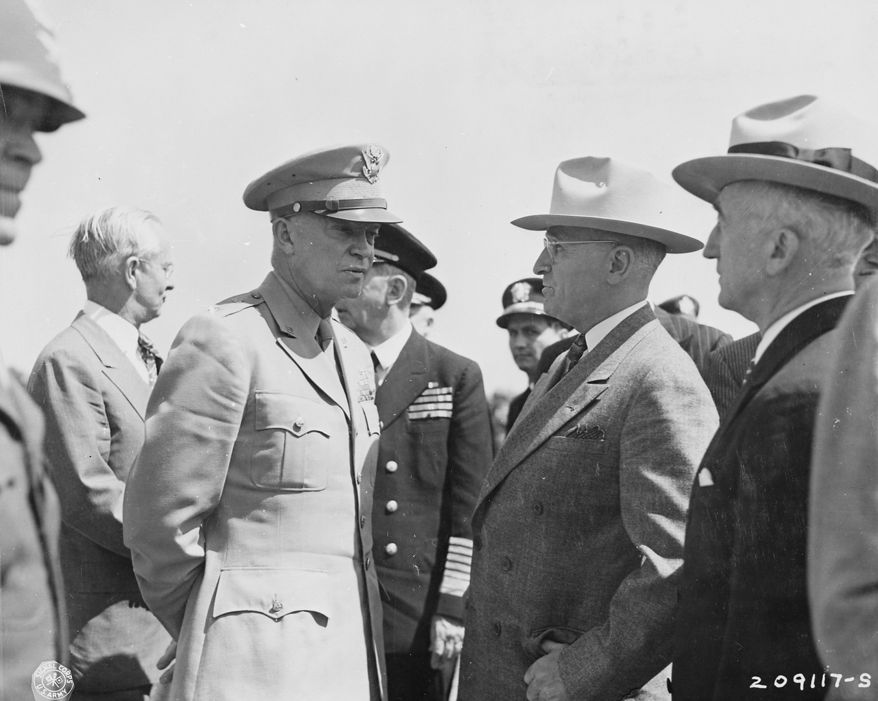 US Army General Dwight Eisenhower and US President Harry Truman at Brussels, Belgium, en route to the Potsdam Conference, 15 Jul 1945; note US Ambassador to Belgium Charles Sawyer and US Secretary of State James Byrnes in background