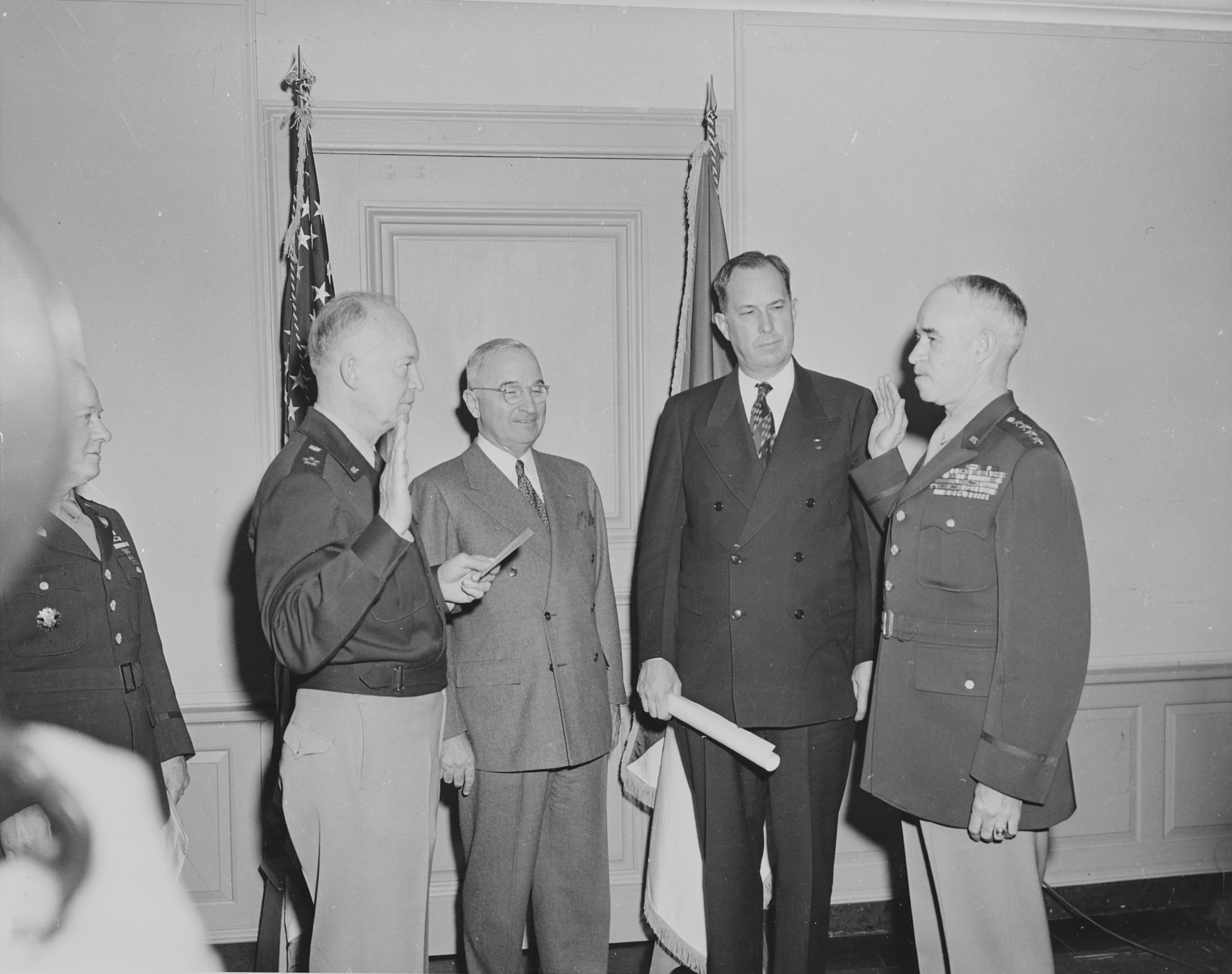 General Dwight Eisenhower swearing General Omar Bradley into office as Chief of Staff of the US Army, Pentagon, Arlington, Virginia, United States, 7 Feb 1948, photo 1 of 3; note US President Harry Truman and Secretary of Army Kenneth Royall in background