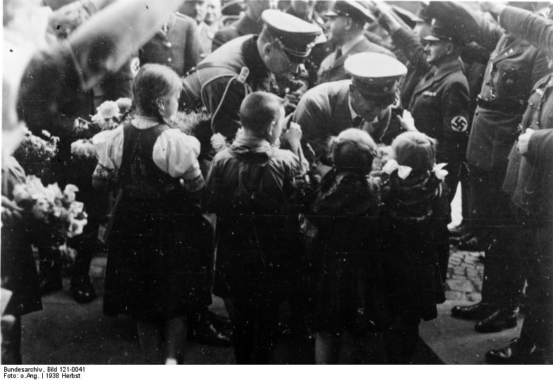 Frick greeted by children, Sudetenland, Czechoslovakia, 23 Sep 1938