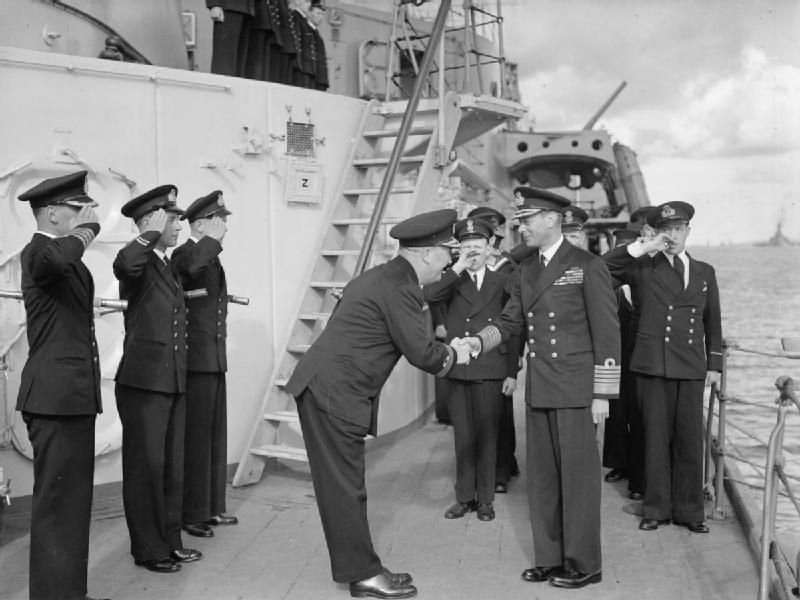 Rear Admiral Robert Burnett greeting King George VI of the United Kingdom aboard HMS Belfast, Scapa Flow, Scotland, United Kingdom, 15 Aug 1943