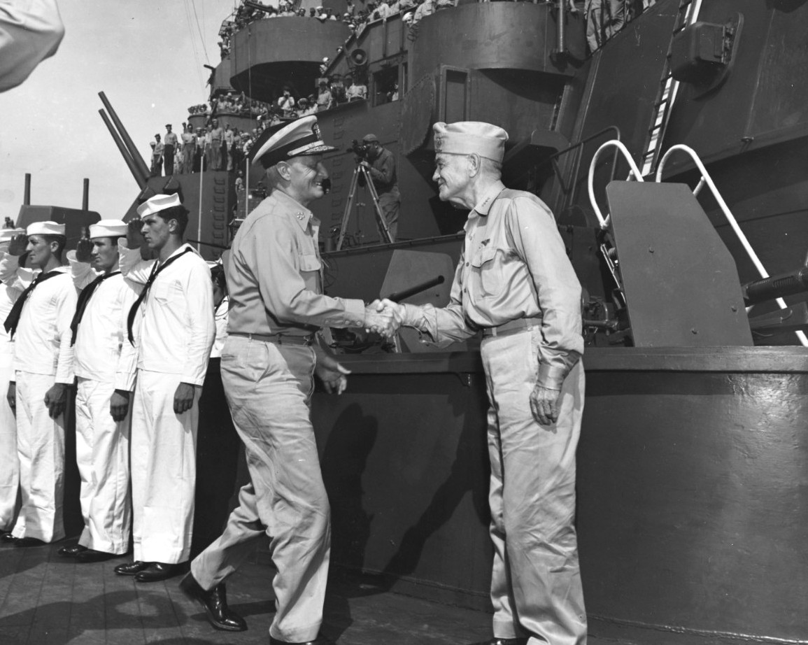 Fleet Admiral Nimitz and Admiral Halsey shaking hands aboard battleship USS South Dakota, Tokyo Bay, Japan, 29 Aug 1945