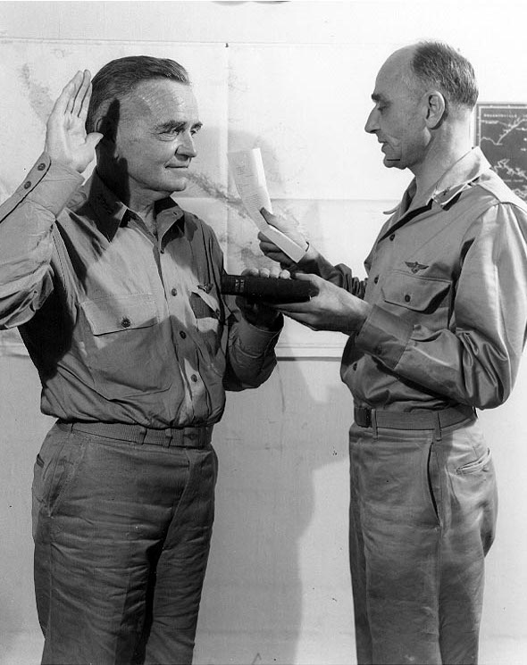 US Navy Admiral William Halsey being sworn in as Commander, South Pacific Force, by his Chief of Staff Captain Miles Browning, 27 Nov 1942