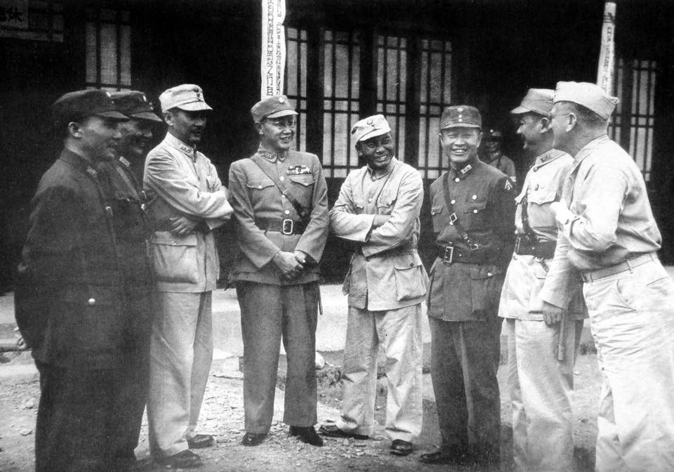 Wang Yaowu, Lu Han, Zhang Fakui, He Yingqin, Tang Enbo, Du Yuming, Xiao Yisu, and an unidentified high ranking US Army officer after the surrender ceremony in Zhijiang, Hunan Province, China, 21 Aug 1945