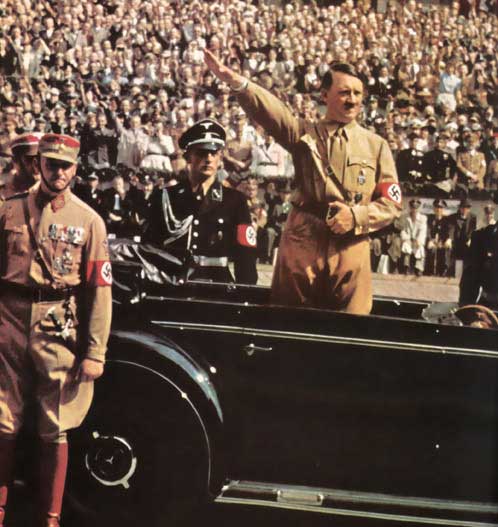 Adolf Hitler saluting a crowd, late 1930s