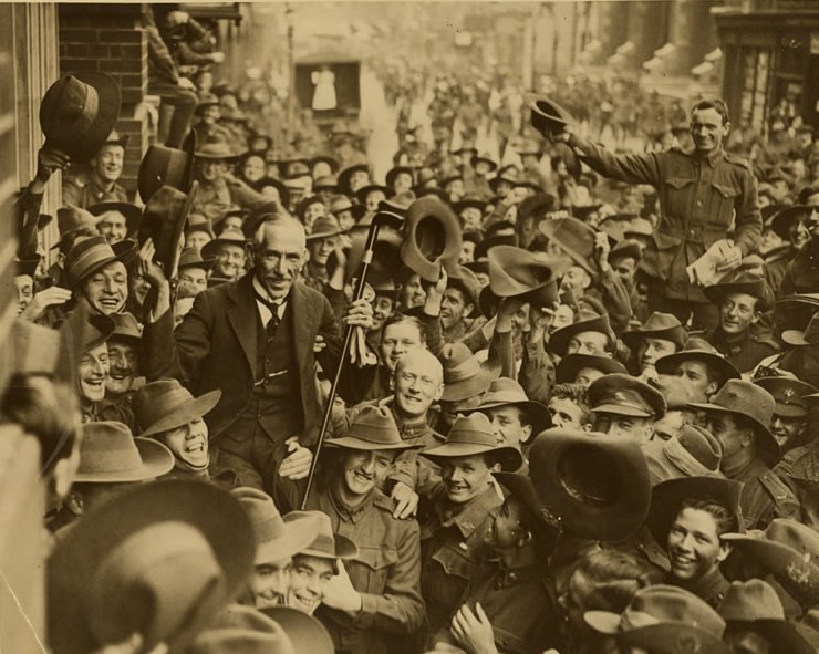 Australian soldiers carrying Billy Hughes along George Street, Sydney, Australia after his return from the Paris Peace Conference, 1919