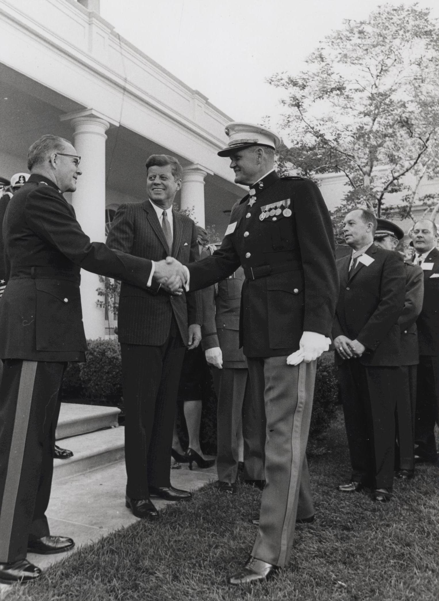 Louis Wilson, Jr. (right) shaking hands with USMC Commandant David Shoup, both Medal of Honor recipients, in the presence of President John Kennedy, White House, Washington DC, United States, circa 1962