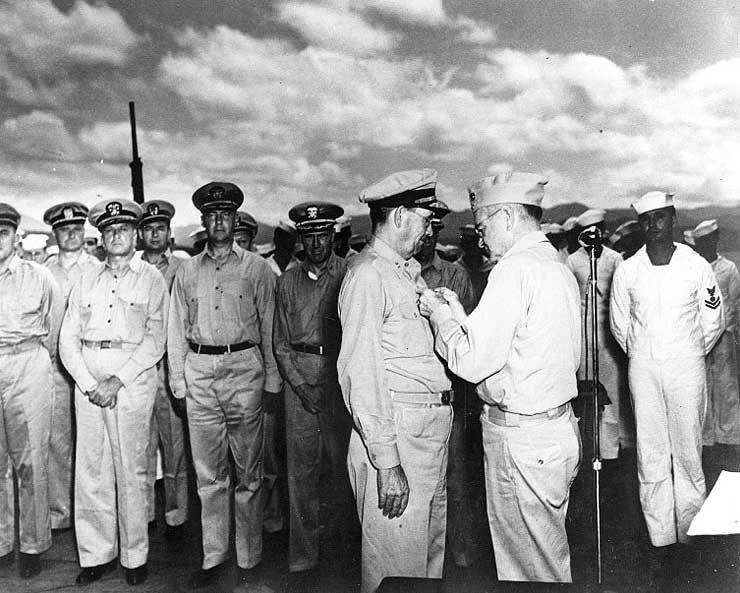 William Halsey presenting Willis Lee with the Navy Cross medal, circa Jan 1943