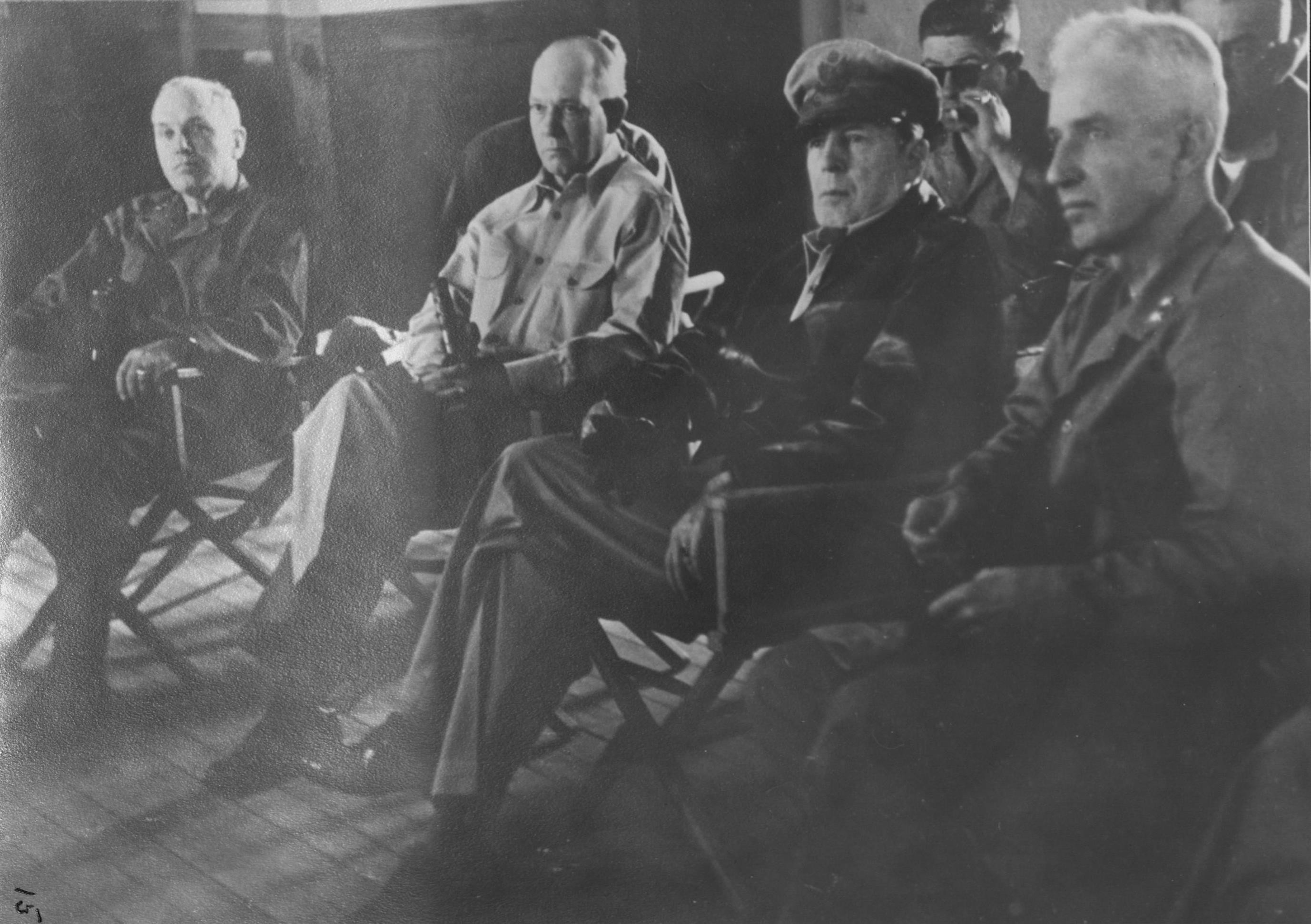 General Edward Almond, General Lemuel Shepherd, General Douglas MacArthur, General Oliver Smith, and Colonel McAllister at a division command post southeast of Inchon, Korea, 17 Sep 1950