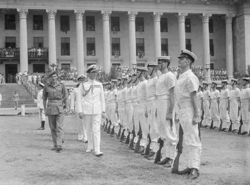Louis Mountbatten inspecting British Royal Navy Guard of Honour outside the Minicipal Building, Singapore prior to the surrender ceremony, 12 Sep 1945