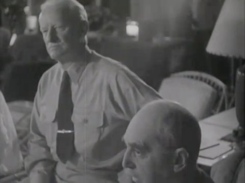 Chester Nimitz listening to Douglas MacArthur's presentation on MacArthur's Pacific War strategy, US Territory of Hawaii, 26 Jul-10 Aug 1944; William Leahy also present in photo
