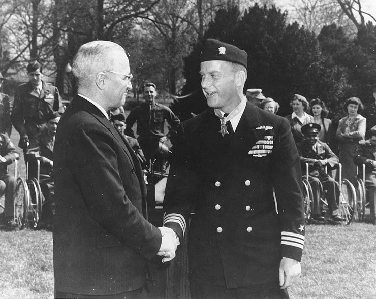 US Navy Commander Richard O'Kane shaking US President Harry Truman's hand on the lawn of the White House shortly after receiving the Medal of Honor, Washington DC, United States, Mar 1946