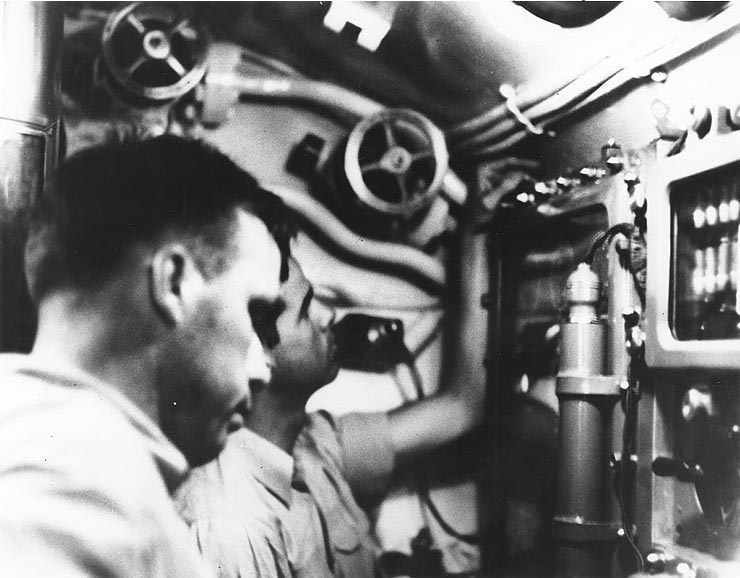 Lieutenant Commander Dudley Morton and Lieutenant Richard O'Kane in the conning tower of USS Wahoo during an attack on a Japanese convoy off New Guinea, 26 Jan 1943