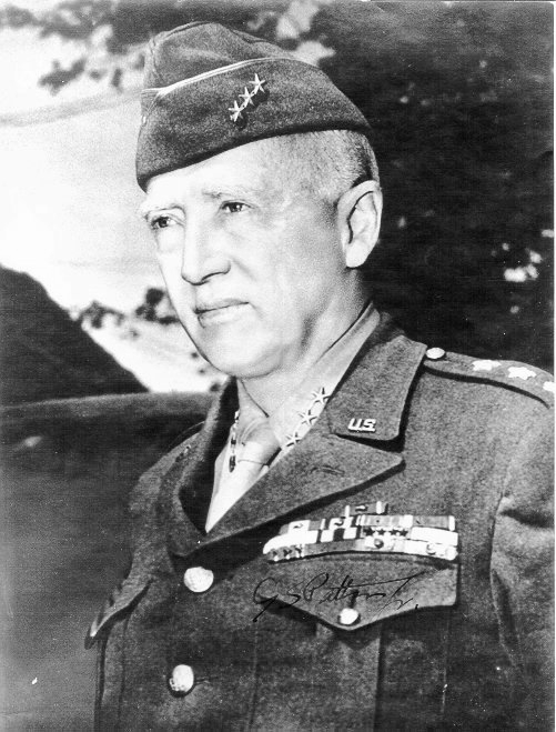 Lieutenant General Patton, Néhou, Basse-Normandie, France, 7 Jul 1944; note autograph on left breast pocket in the photograph