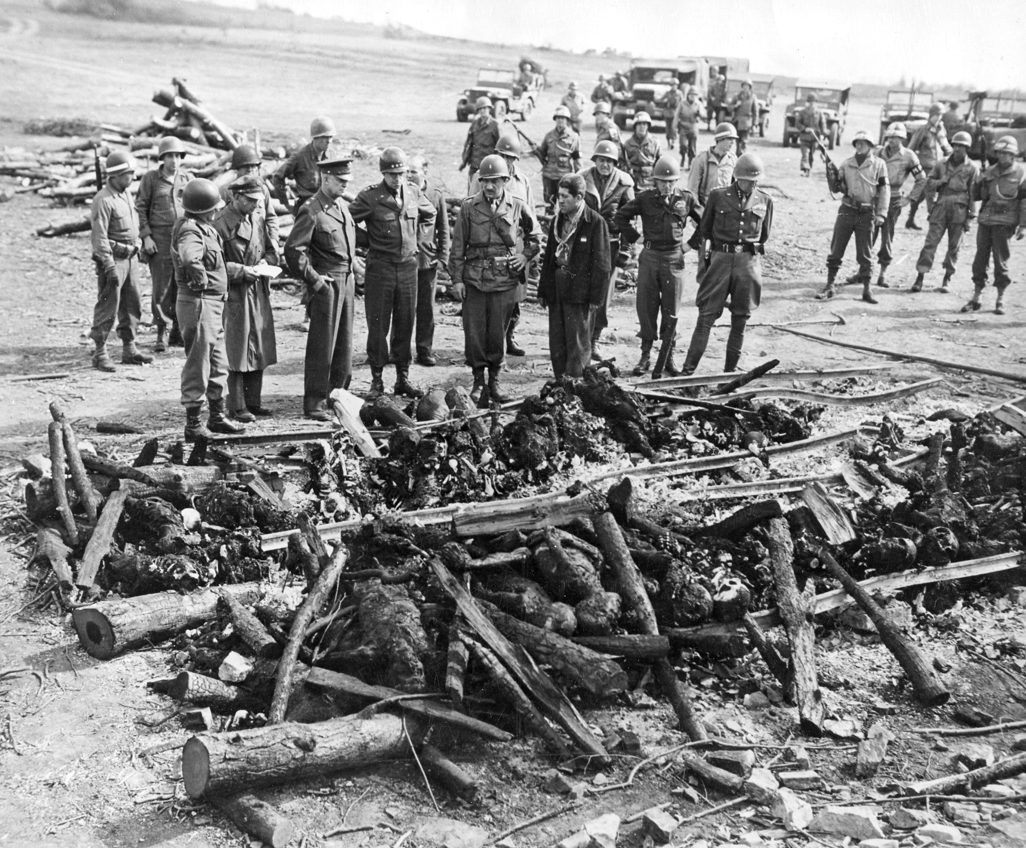 Dwight Eisenhower and other officers inspecting the remains of a German attempt to destroy the remains of dead Jewish prisoners at Ohrdruf Concentration Camp, Gotha, Germany, 12 Apr 1945