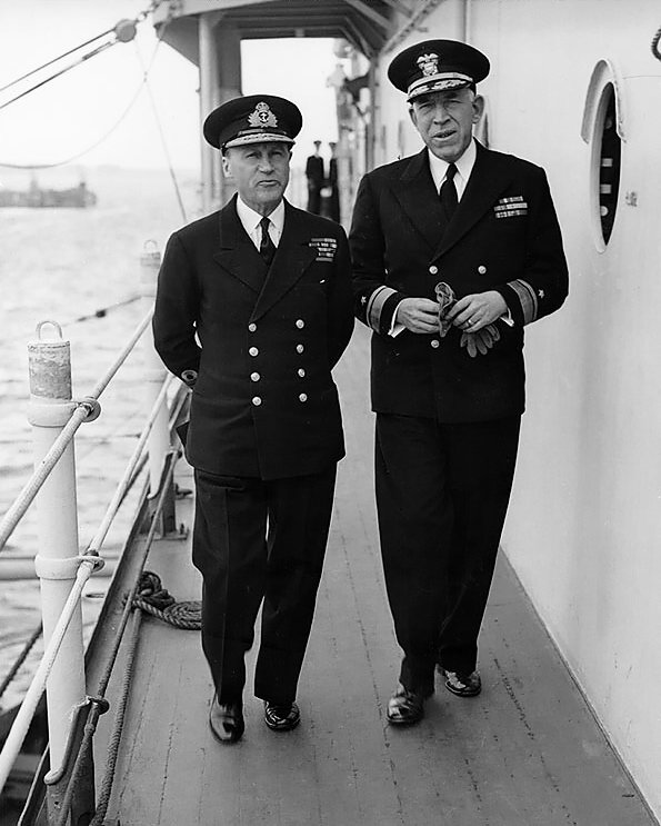 Royal Navy Admiral Sir Bertram Ramsay, Naval commander of the Normandy operations, and US Navy Rear Admiral John L. Hall, Jr., commander of amphibious operations, aboard AGC-4 USS Ancon, 25 May 1944, the day King George VI visited the ship