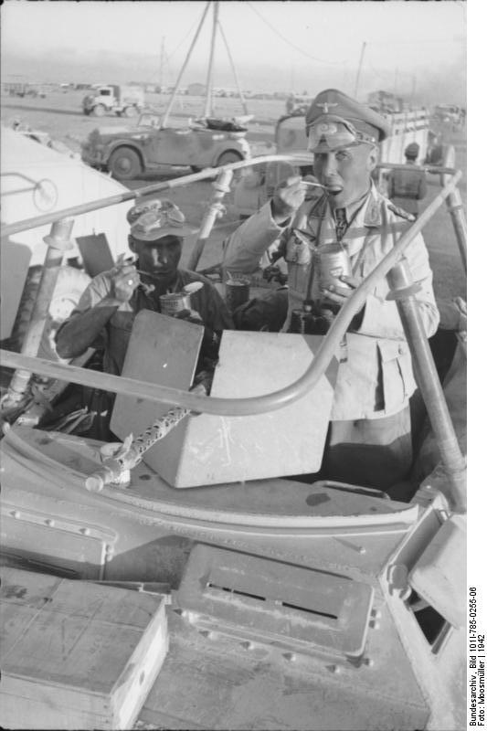Erwin Rommel having a meal in the field in his SdKfz. 250/3 command vehicle 'Greif', North Africa, 1942